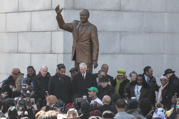 Current and past city council members stand in front of the new statue of Marion Barry outside the John H. Wilson Building ‪in northwest‬ D.C. during an unveiling ceremony on March 2. (Shevry Lassiter/The Washington Informer)