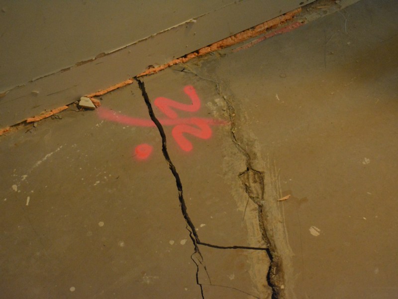 Cracks in the floor of Brittany Bennett’s unit. (Photo courtesy Commissioner McKinney)