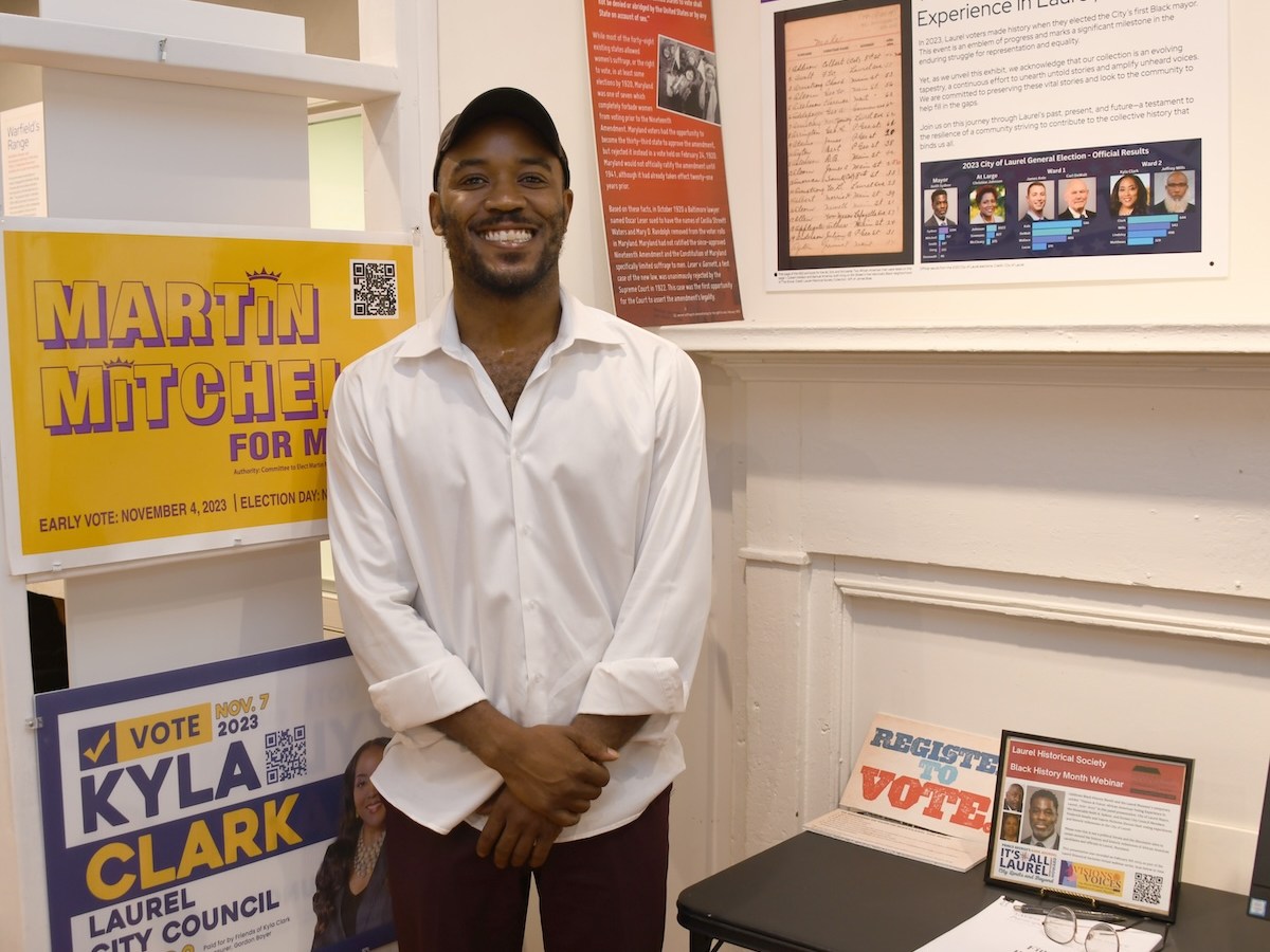 Martin Mitchell, former at-large Laurel Council member, stands in front of his mayoral campaign sign. He ran for mayor in 2023 and was unsuccessful. The Laurel Museum’s newest temporary exhibit, "Visions and Voices 1920-2023, the African American Voting Experience," is running from Feb. 16 through June 16. (Anthony Tilghman/The Washington Informer)