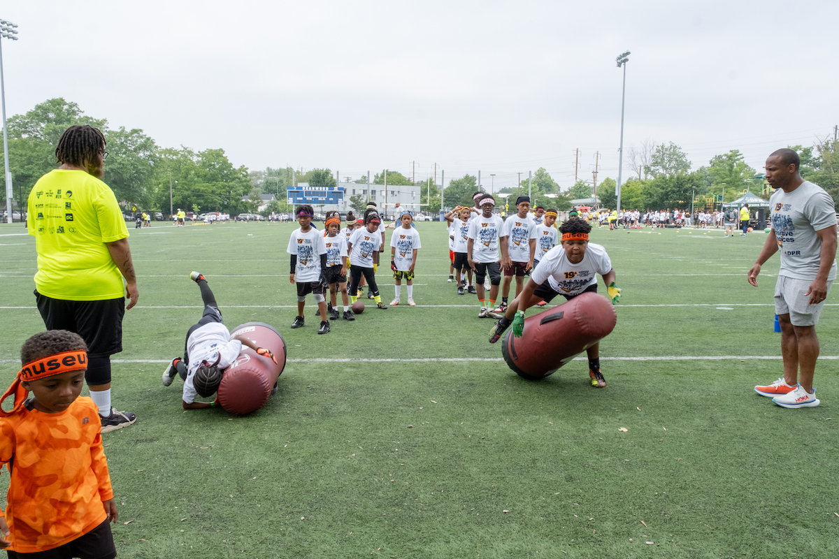 The Military Bowl Foundation and Positive Choices Inc., teamed up to host the 18th annual Youth Football Clinic at Deanwood Recreation Center in D.C. on July 2. (Ja'Mon Jackson/The Washington Informer)