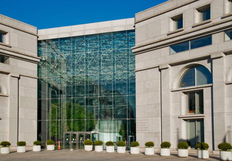 In what Lights Out DC volunteer Jennifer Melot describes as a “death trap” for birds, Thurgood Marshall Federal Judiciary Building has trees inside, clearly visible behind a wall of transparent glass, and is at least partially lit throughout the night. (Ron Cogswell/Creative Commons)