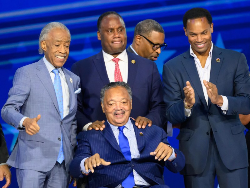 The Rev. Jesse Jackson (front center) was flanked by the Rev. Al Sharpton, his son U.S. Rep Jonathan Jackson and his son Yusef Jackson during the Democratic National Convention on Aug. 20. (Earl Gibson/The Washington Informer)