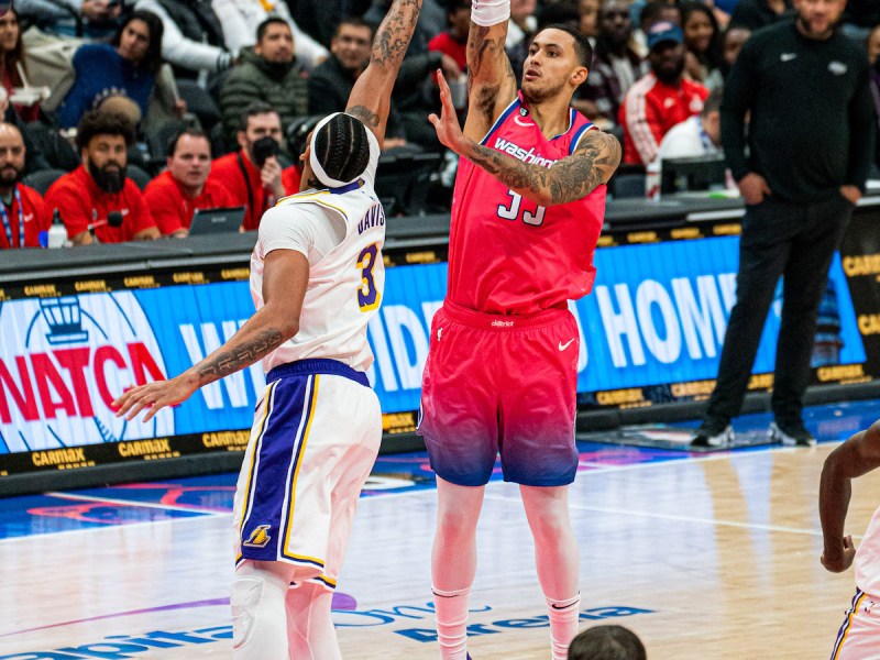 Washington Wizards forward Kyle Kuzma (right) shoots over Los Angeles forward Anthony Davis. (Abdullah J. Konte/The Washington Informer)