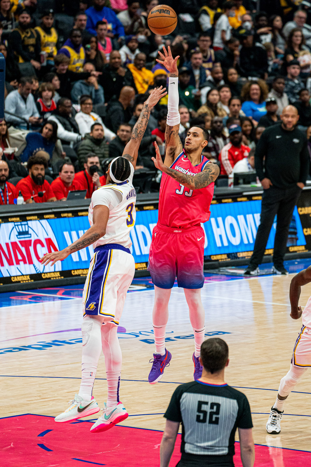 Washington Wizards forward Kyle Kuzma (right) shoots over Los Angeles forward Anthony Davis. (Abdullah J. Konte/The Washington Informer)