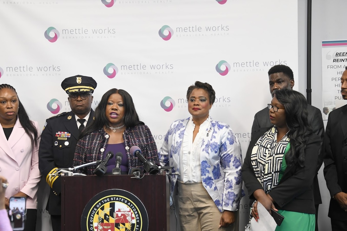 Prince George’s County State's Attorney Aisha Braveboy (at podium) joined Sheriff John Carr, several mayors, and others on Oct. 3 to unveil a plan to drastically reduce the number of family violence cases. (Anthony Tilghman/The Washington Informer)