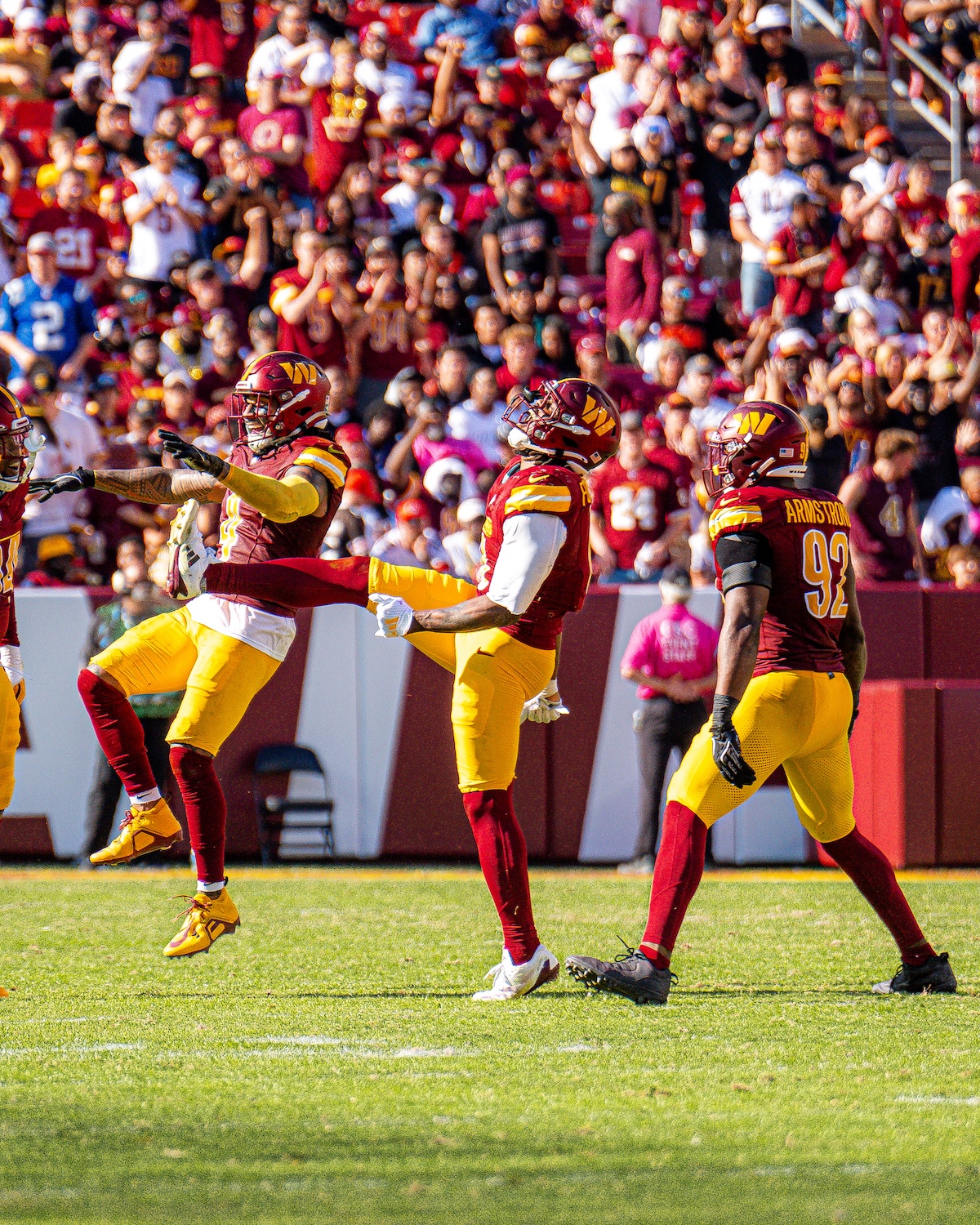 The Washington Commanders celebrate their 34-13 win against the Cleveland Browns on Oct. 6 at Northwest Stadium in Landover, Maryland. (Abdullah Konte/The Washington Informer)