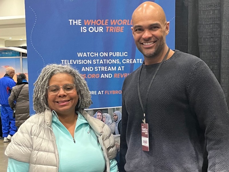 World traveler Ernest White II (right), known as the Fly Brother, poses with a fan of his television travel docuseries. White was a speaker at the Travel and Adventure Show at the Walter E. Washington Convention Center from Feb. 4-5. (D.R. Barnes/The Washington Informer)