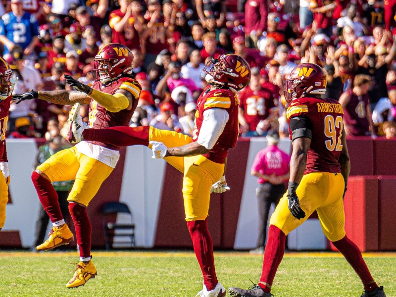 The Washington Commanders celebrate their 34-13 win against the Cleveland Browns on Oct. 6 at Northwest Stadium in Landover, Maryland. (Abdullah Konte/The Washington Informer)