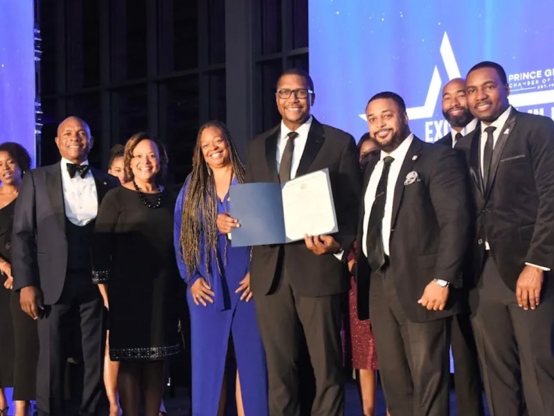 **FILE** During the 2023 Excellence in Business Awards, Prince George’s Chamber of Commerce President Alexander Austin (center) holds a state proclamation, presented for the organization’s achievements and role in empowering the local economy. (Anthony Tilghman/The Washington Informer)