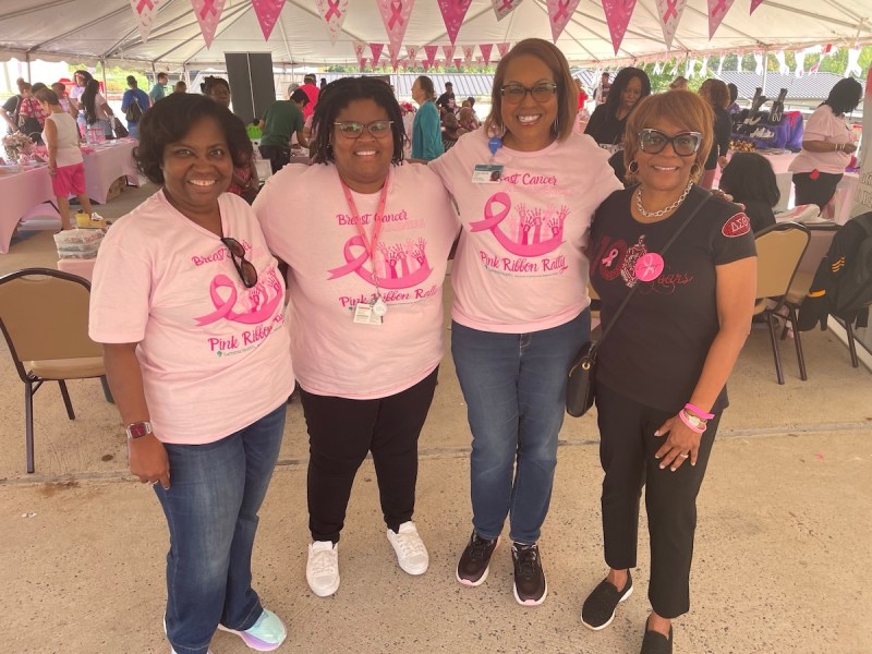 Deneen Richmond, president of Luminis Health Doctors Community Medical Center, Luminis Health breast surgeons Dr. Allison Bruff and Dr. Regina Hampton, and Dr. Deborah Whitehurst-Brown, an Ob-Gyn, pose for a photo at Luminis Health Lanham’s Pink Ribbon Rally, where attendees were offered free mammograms and breast screenings. (Courtesy of Luminis Health)