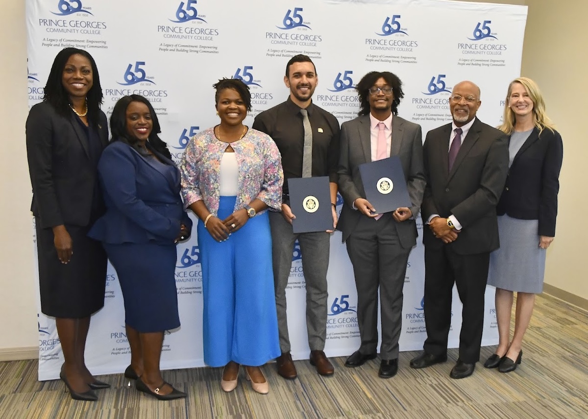 Prince George’s Community College (PGCC) President Dr. Falecia Williams, Prince George's County Council member Wala Blegay, Mary Roberts, Hussein Sharaf, James Poindexter, Rep. Glen Ivey and Allyson Knox at PGCC's Cyber Clinic headquarters on Oct. 4 (Robert R. Roberts/The Washington Informer)