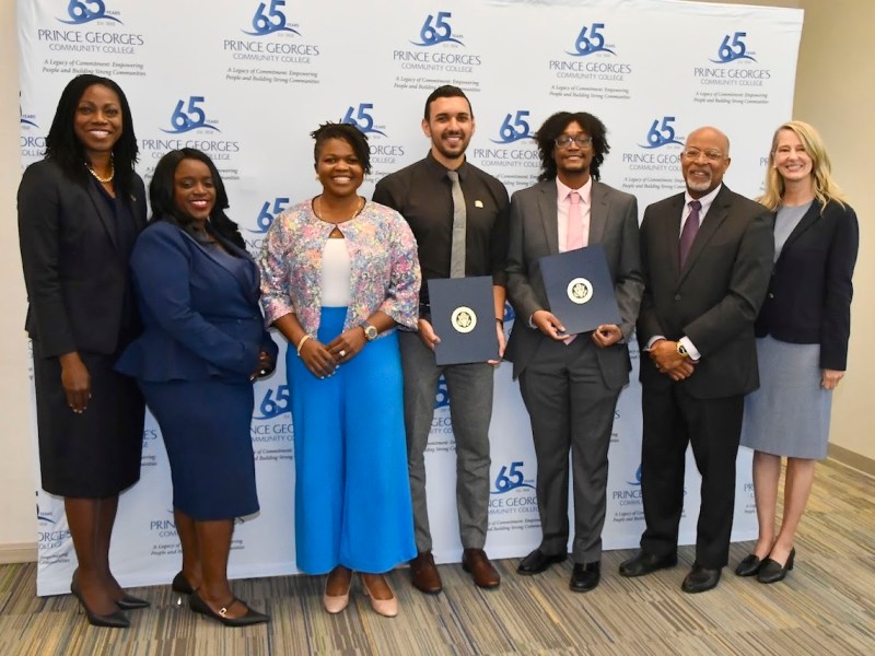 Prince George’s Community College (PGCC) President Dr. Falecia Williams, Prince George's County Council member Wala Blegay, Mary Roberts, Hussein Sharaf, James Poindexter, Rep. Glen Ivey and Allyson Knox at PGCC's Cyber Clinic headquarters on Oct. 4 (Robert R. Roberts/The Washington Informer)