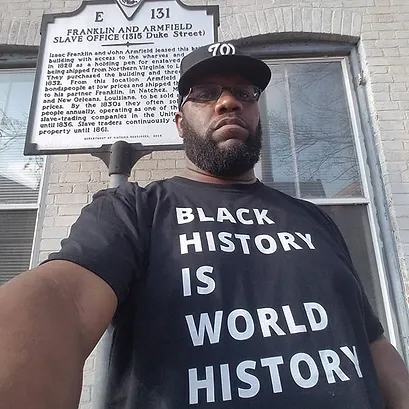 John Taylor Chapman, owner of the Manumission Tour Company, stands before a marker of Franklin & Armfield, a slave trading firm in pre-Civil War Alexandria, Virginia. (Courtesy photo)