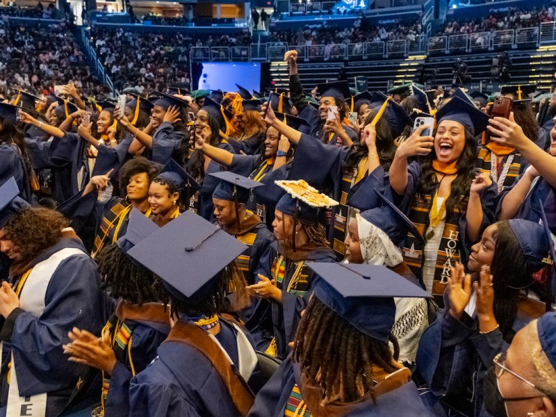 Howard University graduates shout in excitement as each of their departments are officially bestowed their degrees during the 156th commencement convocation. (Ja’Mon Jackson/The Washington Informer)