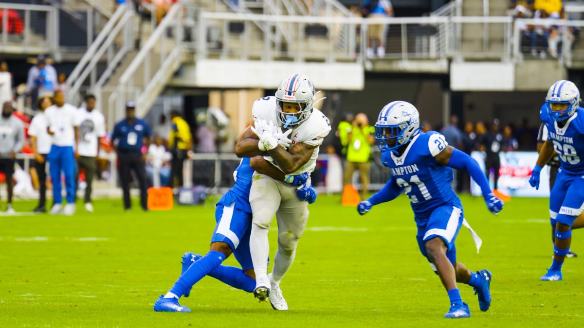 Hampton University Pirates tackle a member of the Howard Bison football team on Sept. 21 during the Truth and Service Classic, often called the battle of “the real HU.” The Pirates defeated the Bison 27-20. (Abdullah Konte/The Washington Informer)