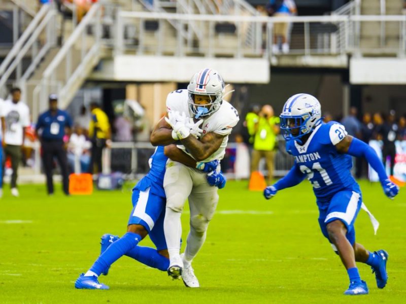 Hampton University Pirates tackle a member of the Howard Bison football team on Sept. 21 during the Truth and Service Classic, often called the battle of “the real HU.” The Pirates defeated the Bison 27-20. (Abdullah Konte/The Washington Informer)