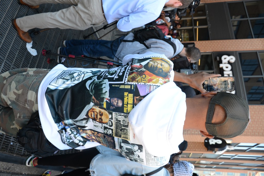 An activist dons a hoodie in honor of former D.C. Mayor Marion Barry while attending a protest of &pizza's "Marion Berry Knots," a desert that many activists said disrespected the legacy of the late leader due to drug-related references. (Roy Lewis/The Washington Informer)