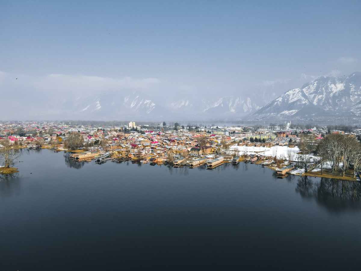 aerial shot of a town by the lake