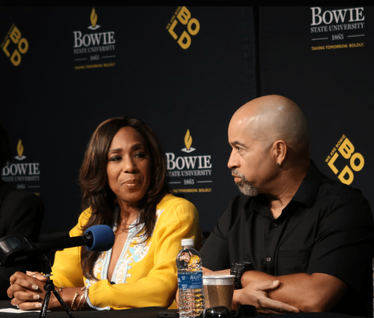 "A Different World" cast members Dawnn Lewis and Darryl Bell at Bowie State University on Oct. 17. The cast is touring historically Black colleges and universities across the country to encourage enrollment, raise scholarship funds and promote financial literacy. (Courtesy of Bowie State University via X)